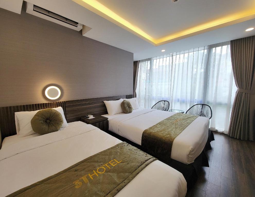 Postel nebo postele na pokoji v ubytování 3T Hotel Hanoi