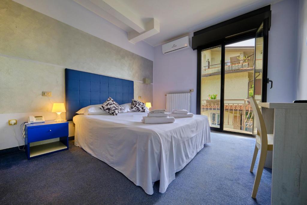 Postel nebo postele na pokoji v ubytování HOTEL VITTORIA