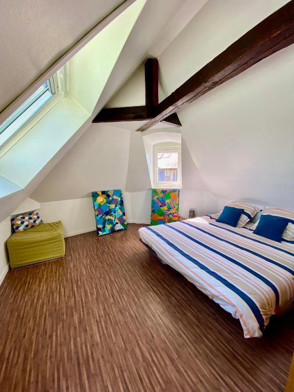 Posteľ alebo postele v izbe v ubytovaní Toutes voiles dehors - Vue mer & château - Cosy
