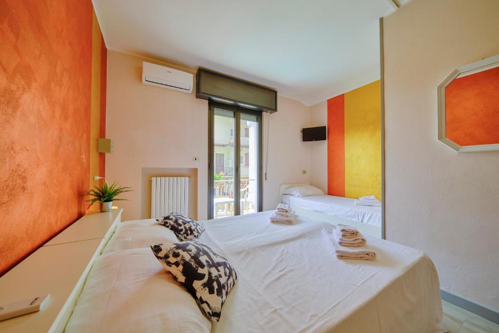 Postel nebo postele na pokoji v ubytování HOTEL VITTORIA