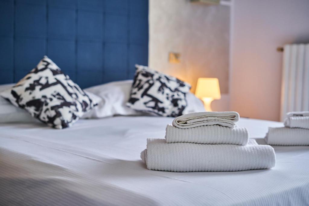 Postel nebo postele na pokoji v ubytování HOTEL VITTORIA