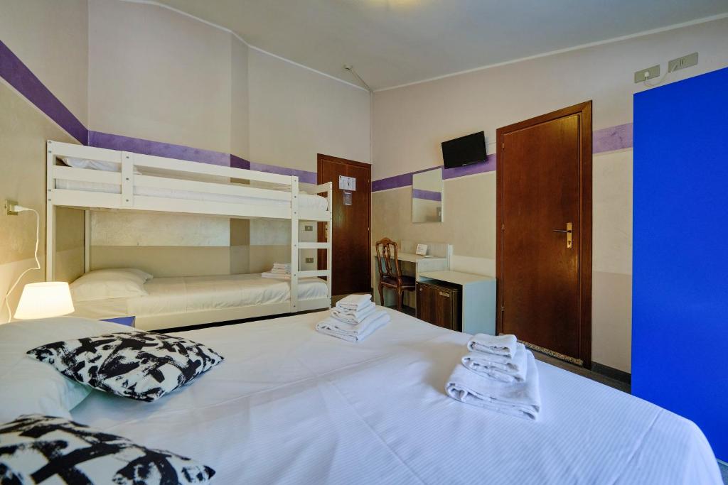 Postel nebo postele na pokoji v ubytování HOTEL VITTORIA