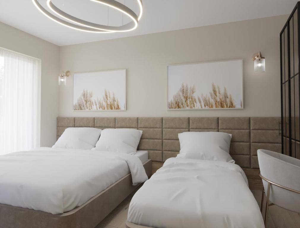 Postel nebo postele na pokoji v ubytování Struga Riverview Hotel