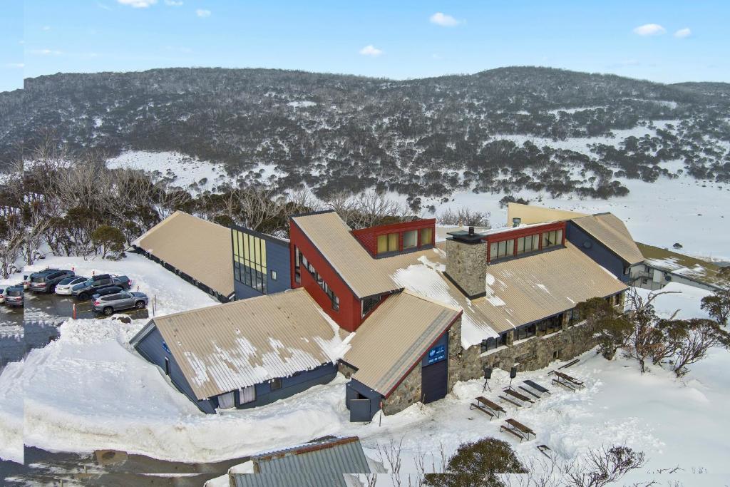 an aerial view of a house in the snow at Snowy Gums Smiggins in Perisher Valley