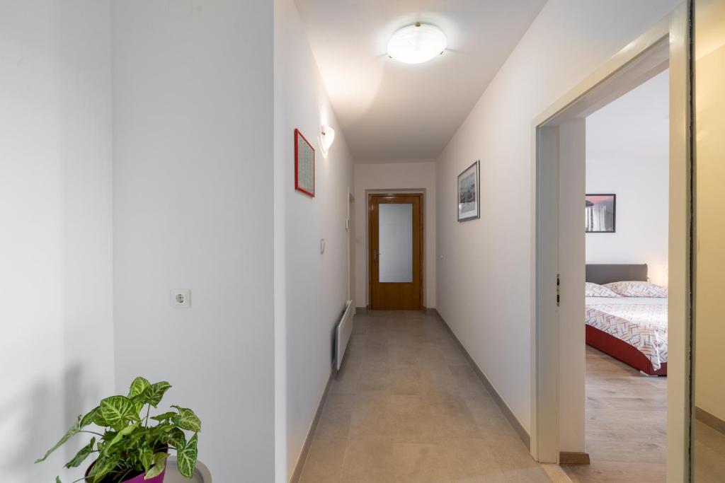 Postel nebo postele na pokoji v ubytování Family apartments - Guesthouse Vranješ