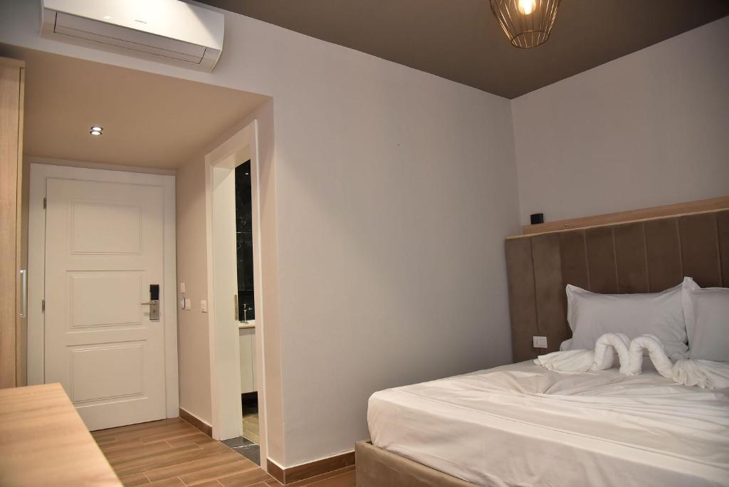 Postel nebo postele na pokoji v ubytování Hotel Lubjana