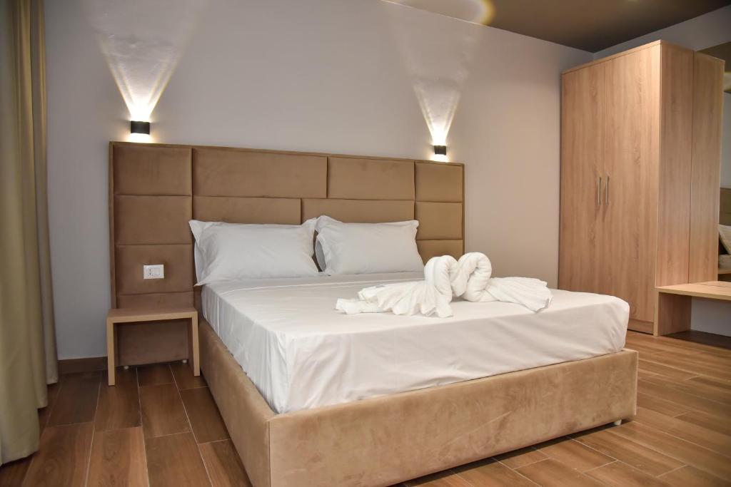 Postel nebo postele na pokoji v ubytování Hotel Lubjana