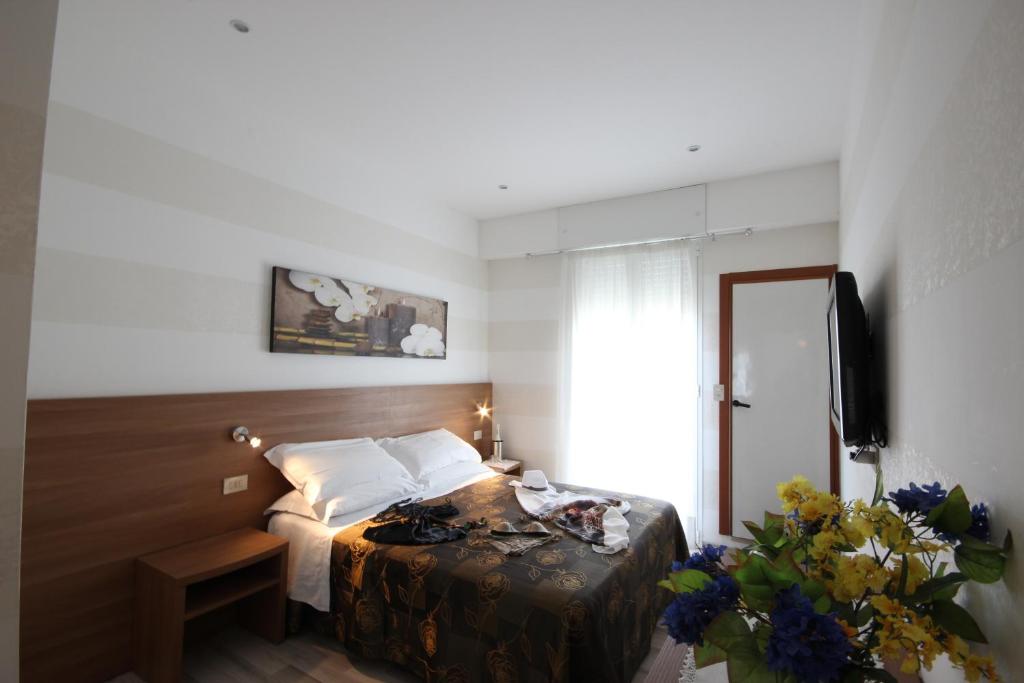Postel nebo postele na pokoji v ubytování Hotel Arabel