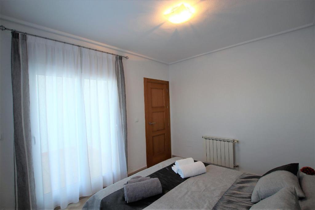 Postel nebo postele na pokoji v ubytování Adosado Roldán by Rental Olé