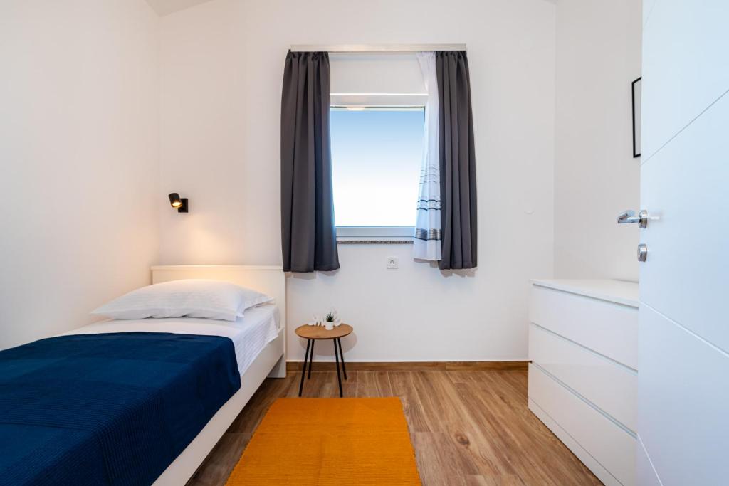 Łóżko lub łóżka w pokoju w obiekcie la More Apartments