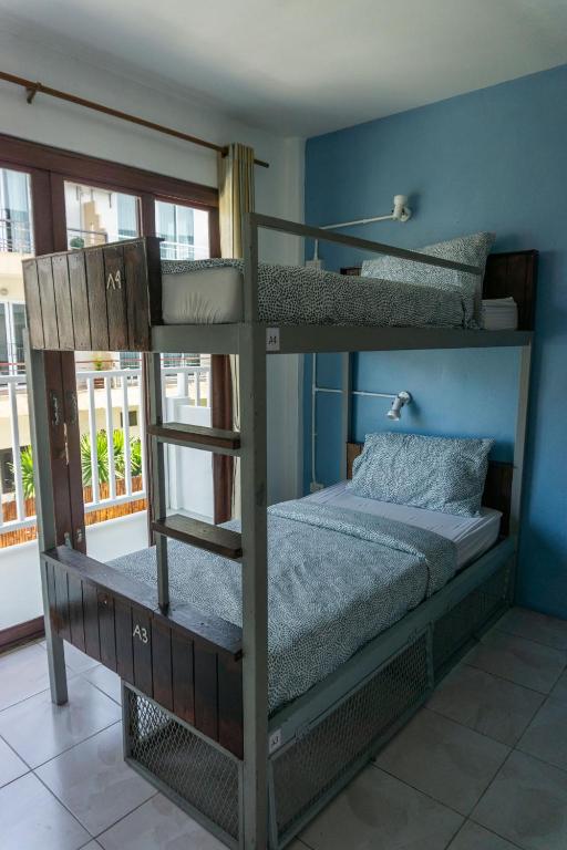 Voodi või voodid majutusasutuse Isla Tortuga Diving & Hostel toas