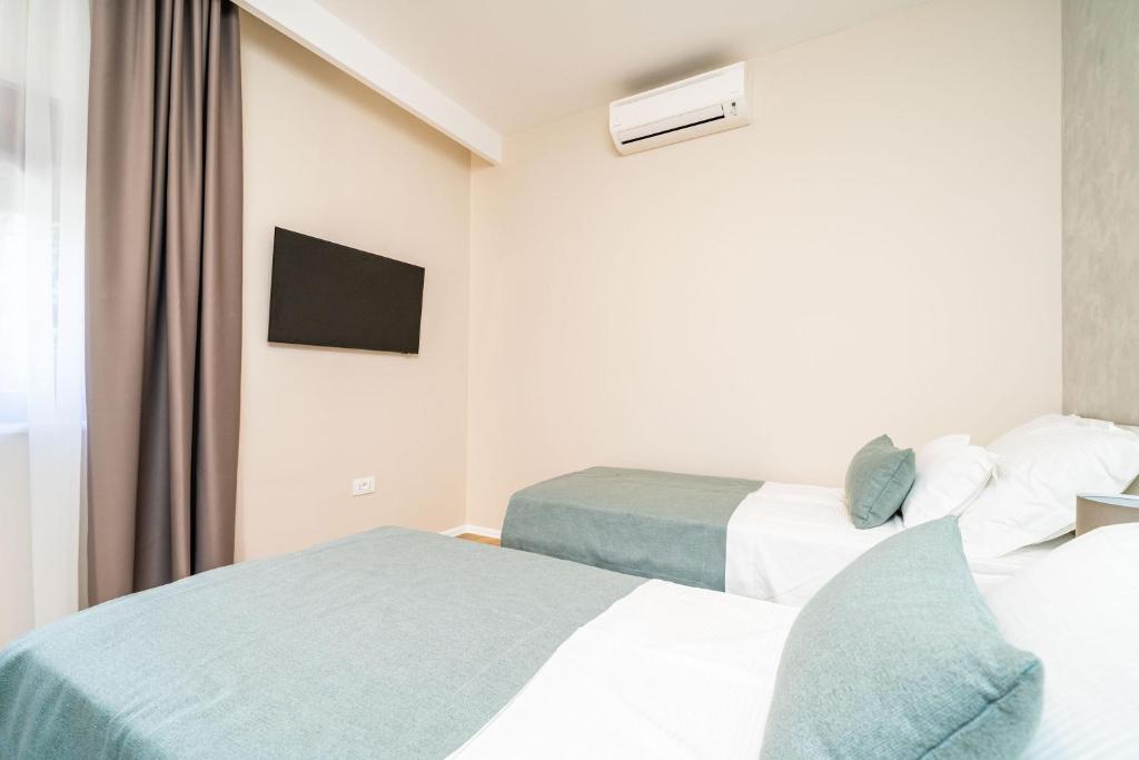 Posteľ alebo postele v izbe v ubytovaní Apartment Simple Suite