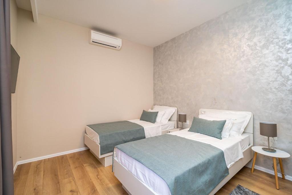 Posteľ alebo postele v izbe v ubytovaní Apartment Simple Suite