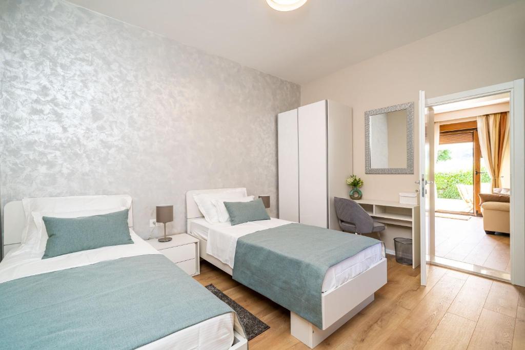 Posteľ alebo postele v izbe v ubytovaní Apartment Simple Suite