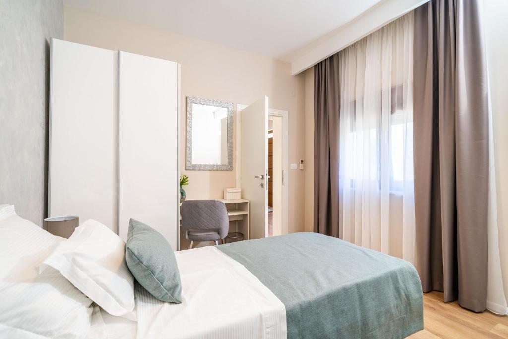 Posteľ alebo postele v izbe v ubytovaní Apartment Simple Suite