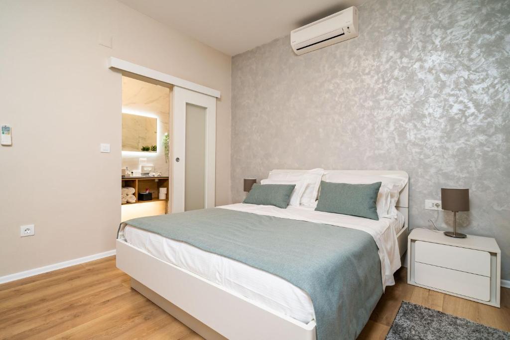 Posteľ alebo postele v izbe v ubytovaní Apartment Simple Suite