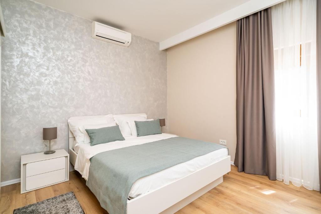 Posteľ alebo postele v izbe v ubytovaní Apartment Simple Suite