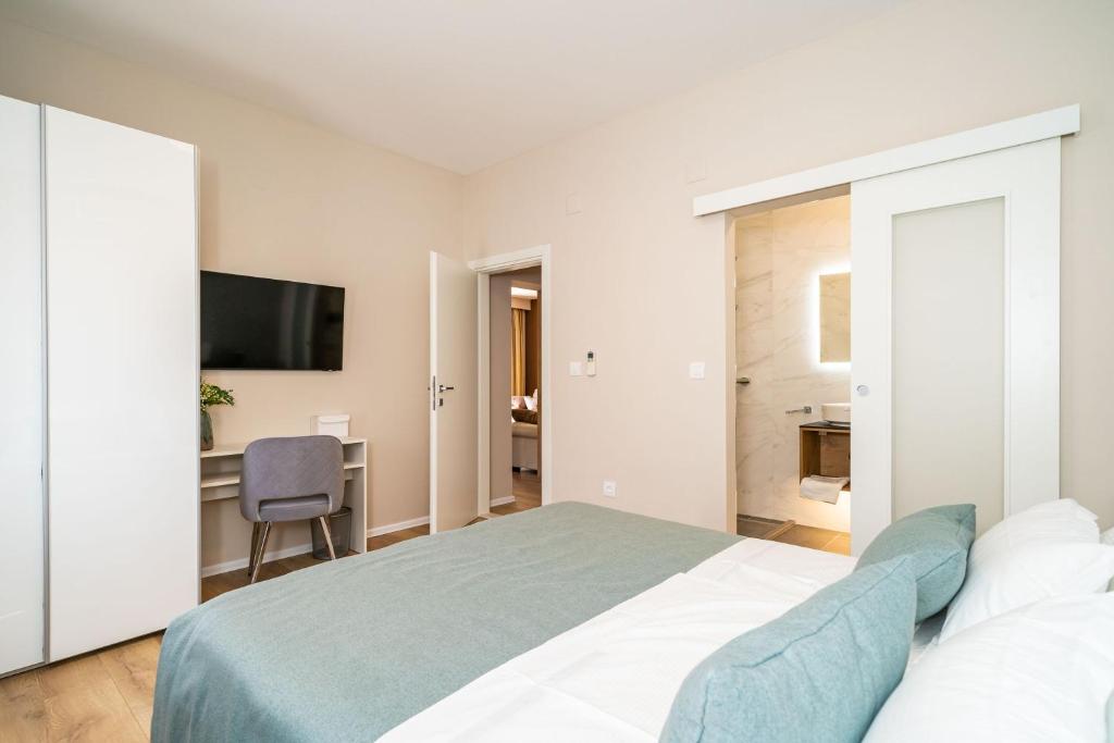 Posteľ alebo postele v izbe v ubytovaní Apartment Simple Suite