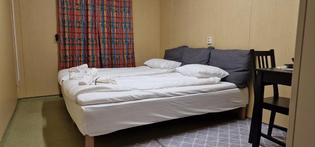 Postel nebo postele na pokoji v ubytování Tinyhouse Guesthouse next to forest and lake