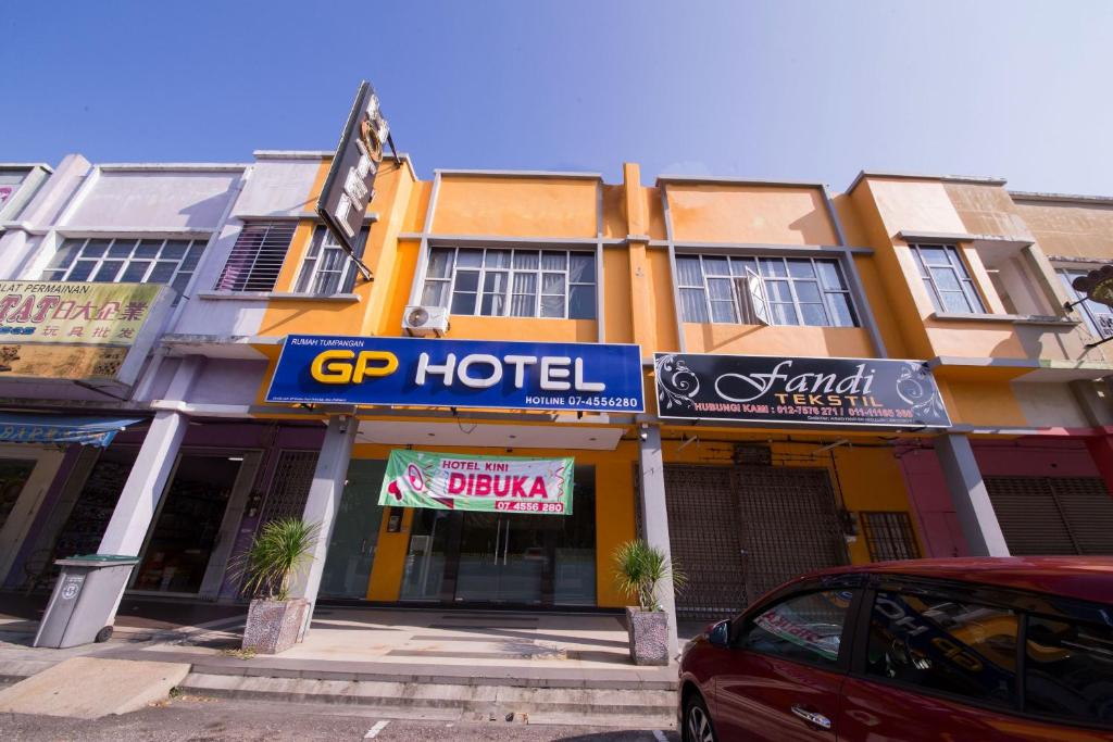 a hotel with a car parked in front of it at Golden Pearl Hotel Near Universiti Tun Hussein Onn Malaysia UTHM in Batu Pahat