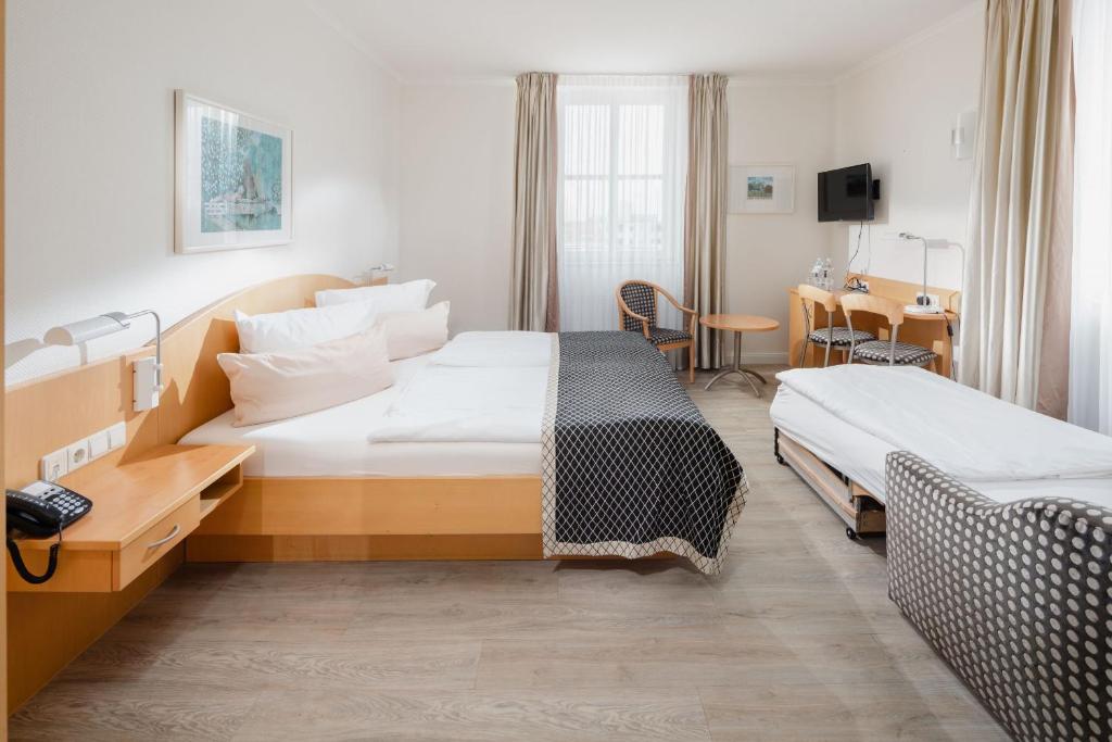 Rúm í herbergi á Hotel Künstlerhaus
