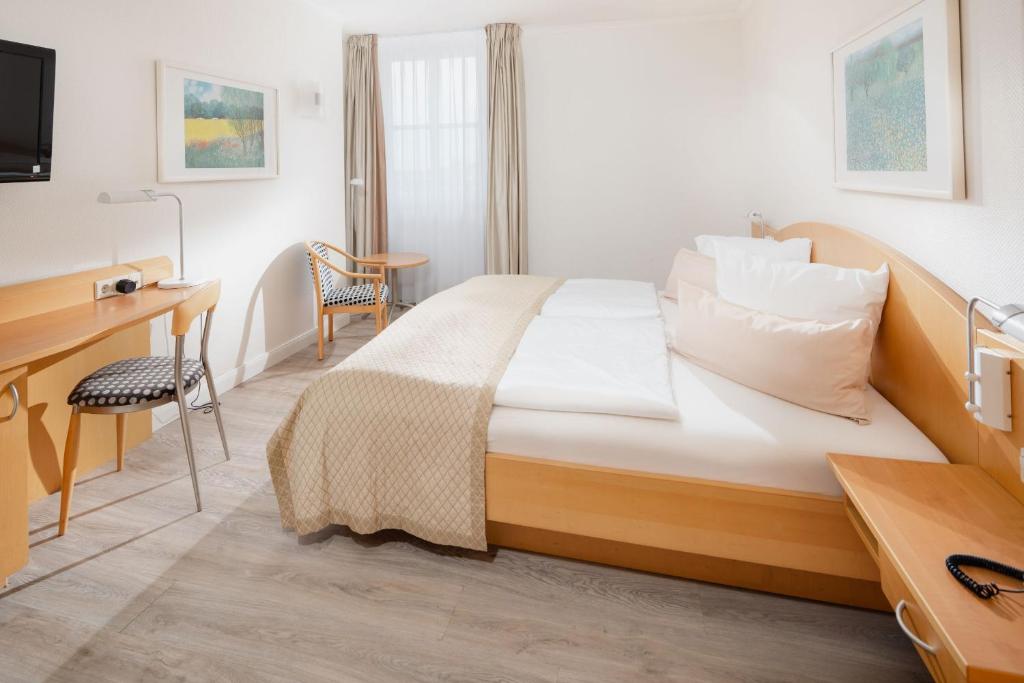 Rúm í herbergi á Hotel Künstlerhaus