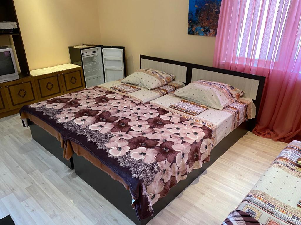 Кровать или кровати в номере Гостевой дом «На Советов»