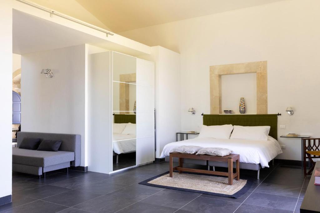 Postel nebo postele na pokoji v ubytování Masseria del Carrubo