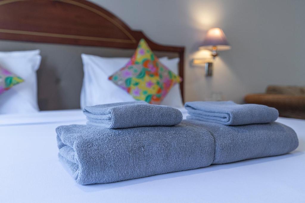 Postel nebo postele na pokoji v ubytování Sabai Inn