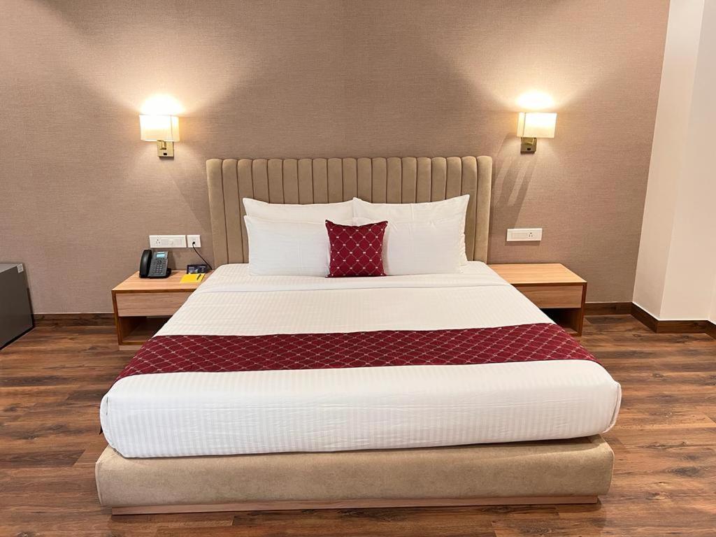 Postel nebo postele na pokoji v ubytování Palasa Hotel