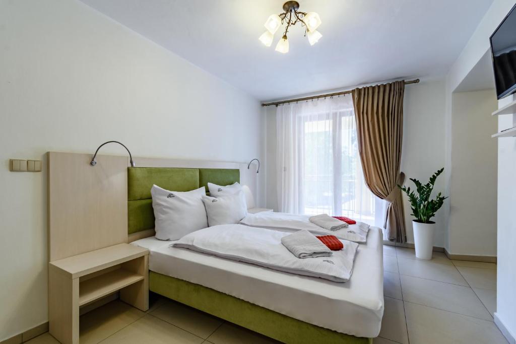 Posteľ alebo postele v izbe v ubytovaní Paula Wellness & SPA