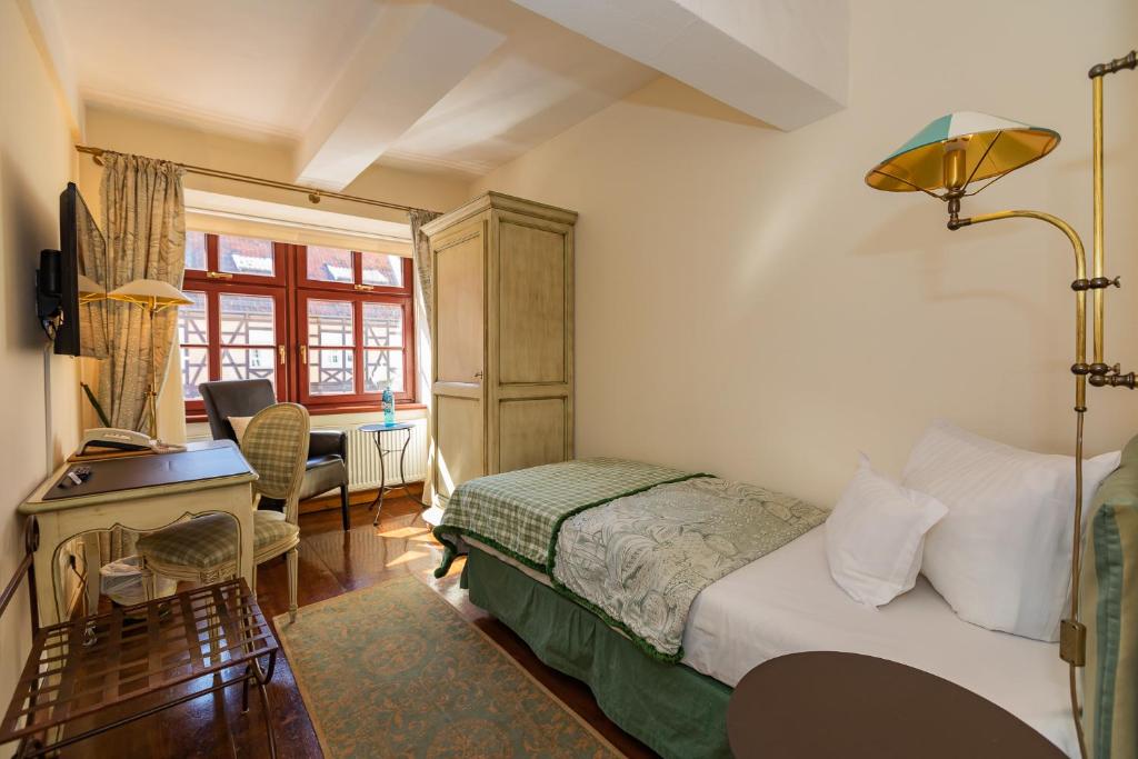 Postel nebo postele na pokoji v ubytování Hotel Zum Bär