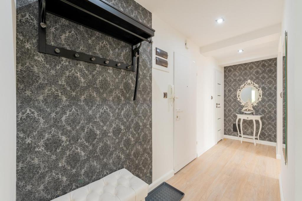 Łóżko lub łóżka w pokoju w obiekcie Szafir Apartament