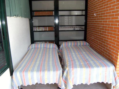 A bed or beds in a room at SOLO FAMILIAS TORRESOL
