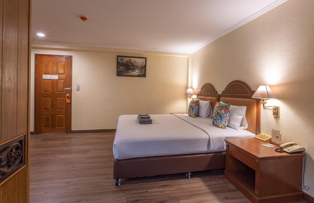 Postel nebo postele na pokoji v ubytování Sabai Inn