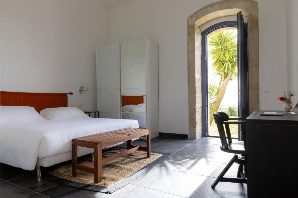 Postel nebo postele na pokoji v ubytování Masseria del Carrubo