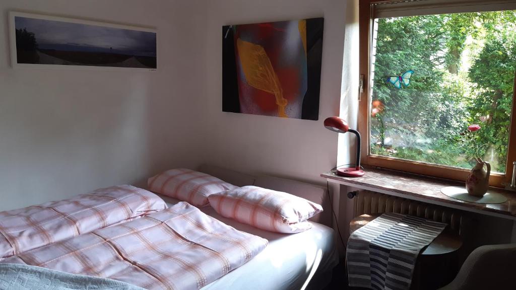 Ένα ή περισσότερα κρεβάτια σε δωμάτιο στο kunst-at-home