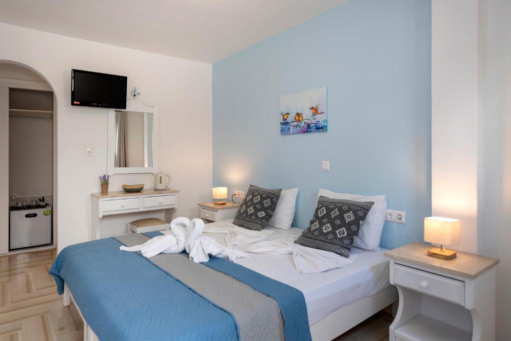 Postel nebo postele na pokoji v ubytování Ayeri Hotel