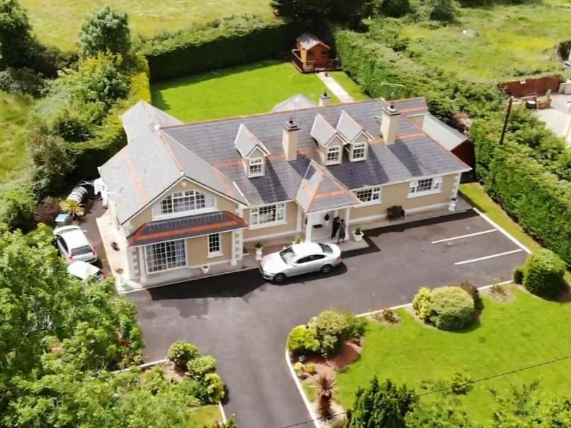 an aerial view of a house with a car parked in a parking lot at Leabrook House in Castlemaine