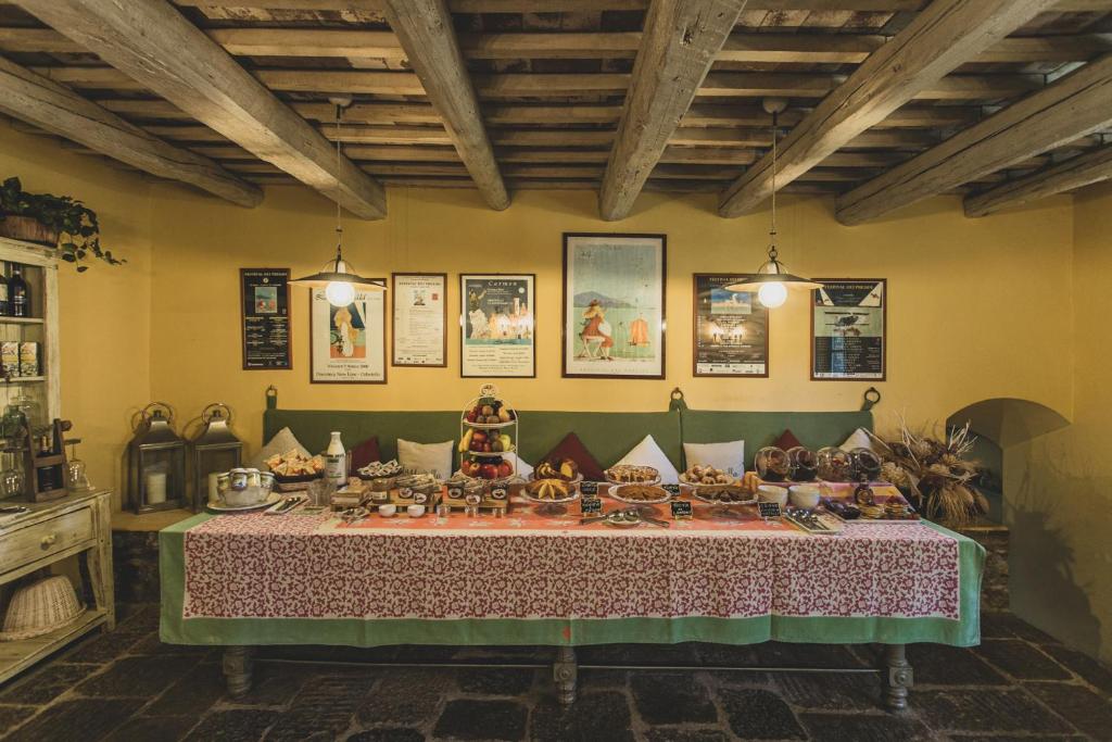 a room with a table with food on it at Country Relais La Mortella in Porto Ercole