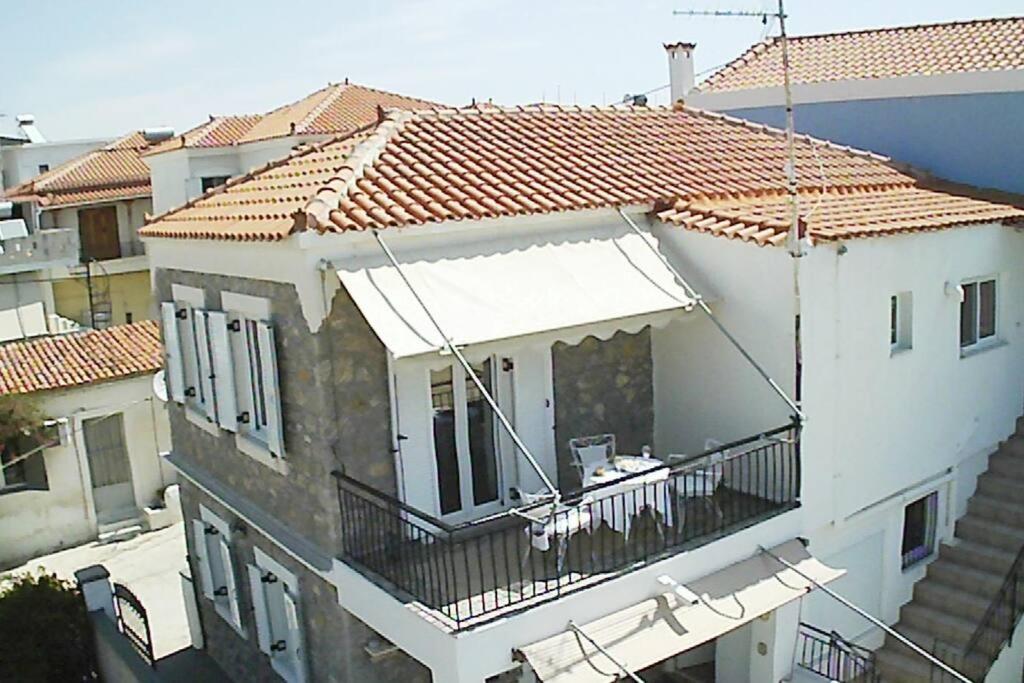 an aerial view of a building with a balcony at Roubinis House in Ermioni