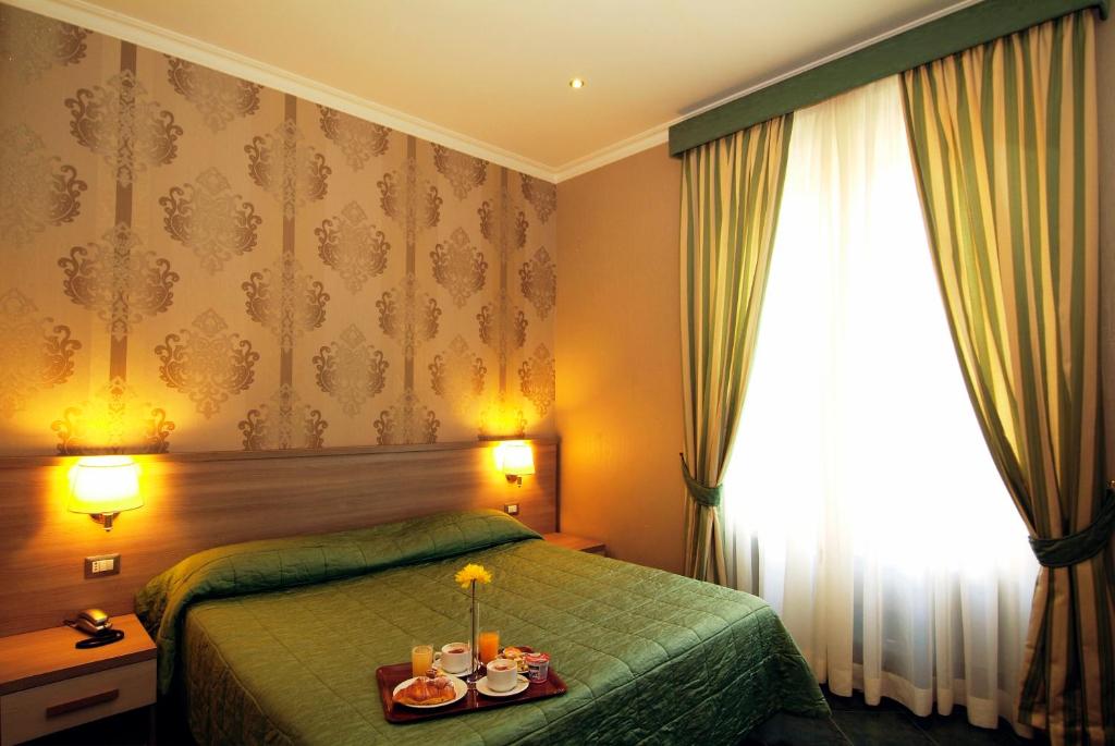 Posteľ alebo postele v izbe v ubytovaní Hotel Argentina