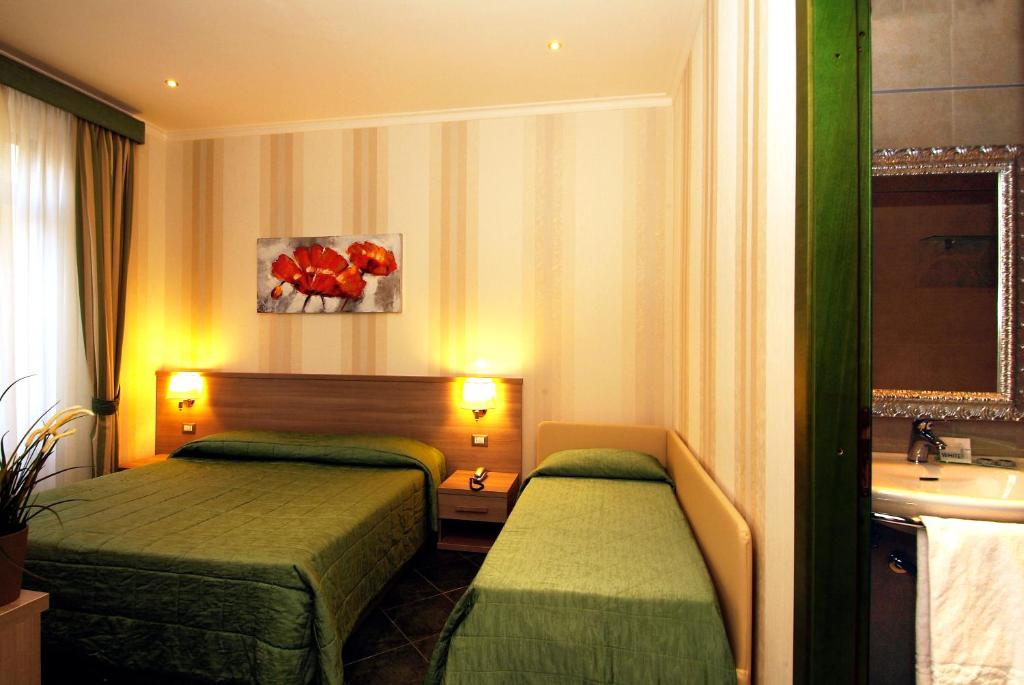 Posteľ alebo postele v izbe v ubytovaní Hotel Argentina