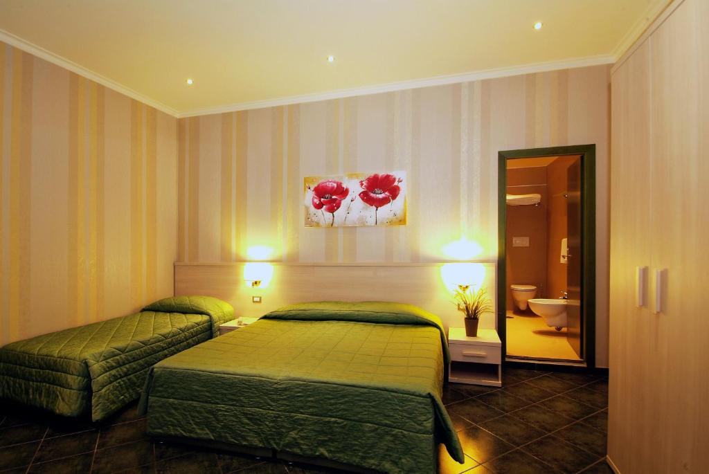 Posteľ alebo postele v izbe v ubytovaní Hotel Argentina