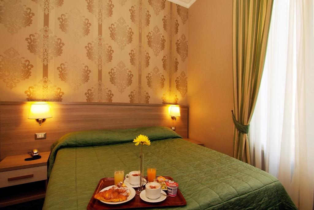 Posteľ alebo postele v izbe v ubytovaní Hotel Argentina