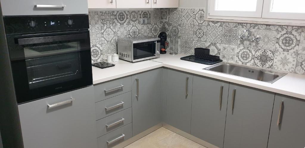 A kitchen or kitchenette at Panoramic Apartment