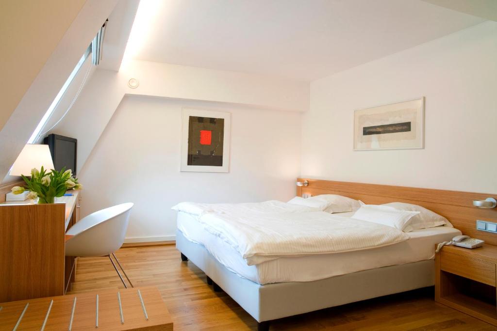Postel nebo postele na pokoji v ubytování Hotel Simoncini