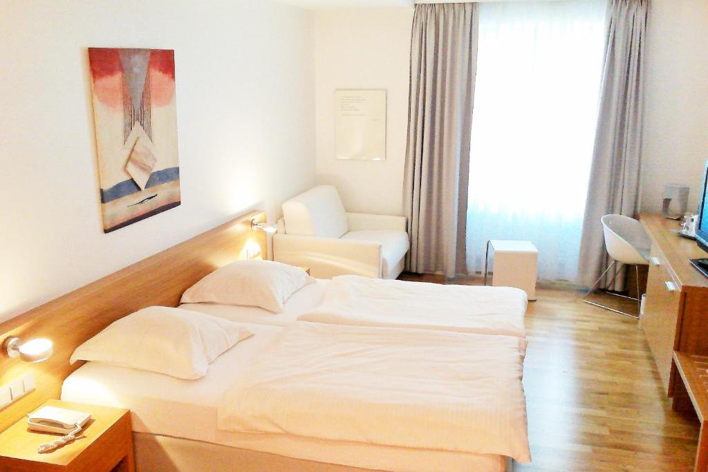 Postel nebo postele na pokoji v ubytování Hotel Simoncini