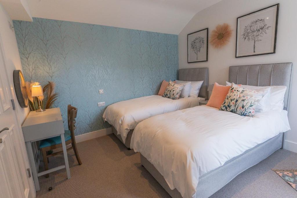 Postel nebo postele na pokoji v ubytování Carrick Rooms