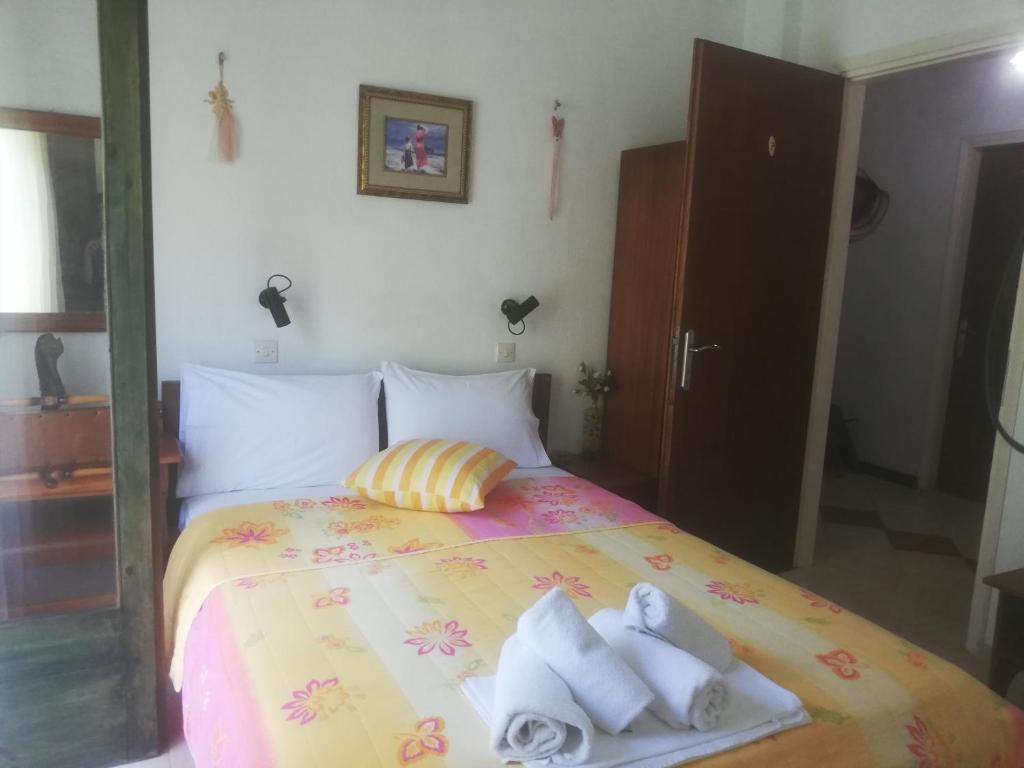 Postel nebo postele na pokoji v ubytování Atlantis Hotel
